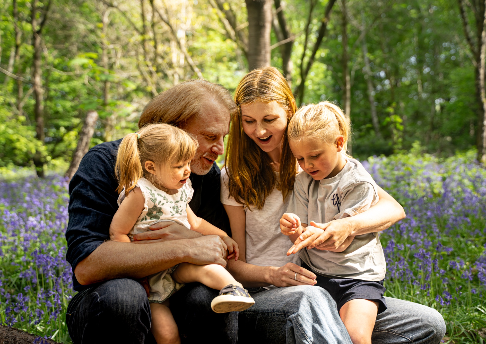 Children laughing together during a family photography session